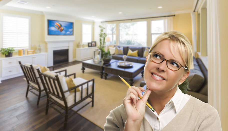 Attractive Daydreaming Woman with Pencil Inside Beautiful Living Room. photo : Attractive Daydreaming Woman with Pencil Inside Beautiful Living Room.