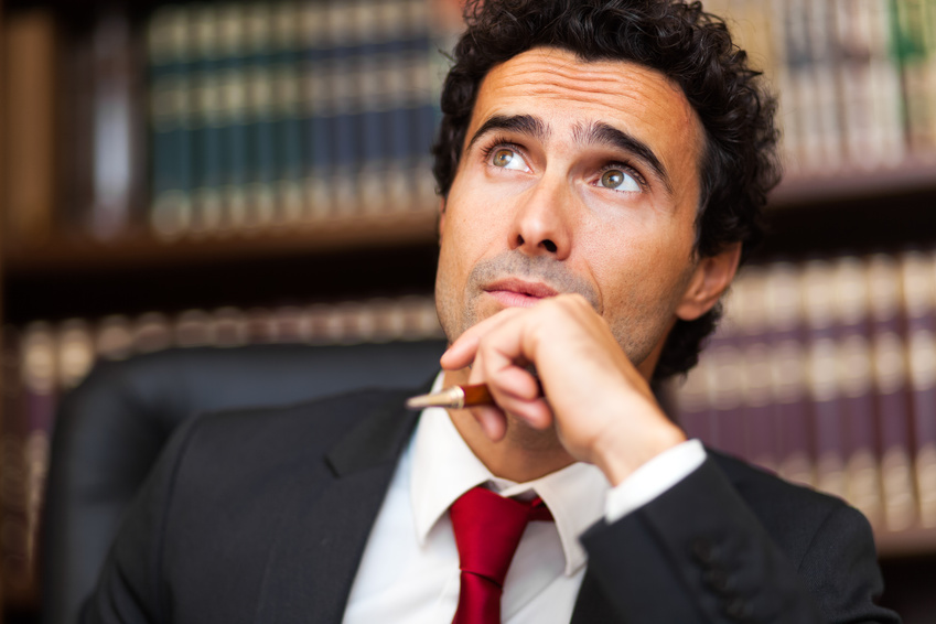 Confident businessman thinking at a problem photo : Confident businessman thinking at a problem