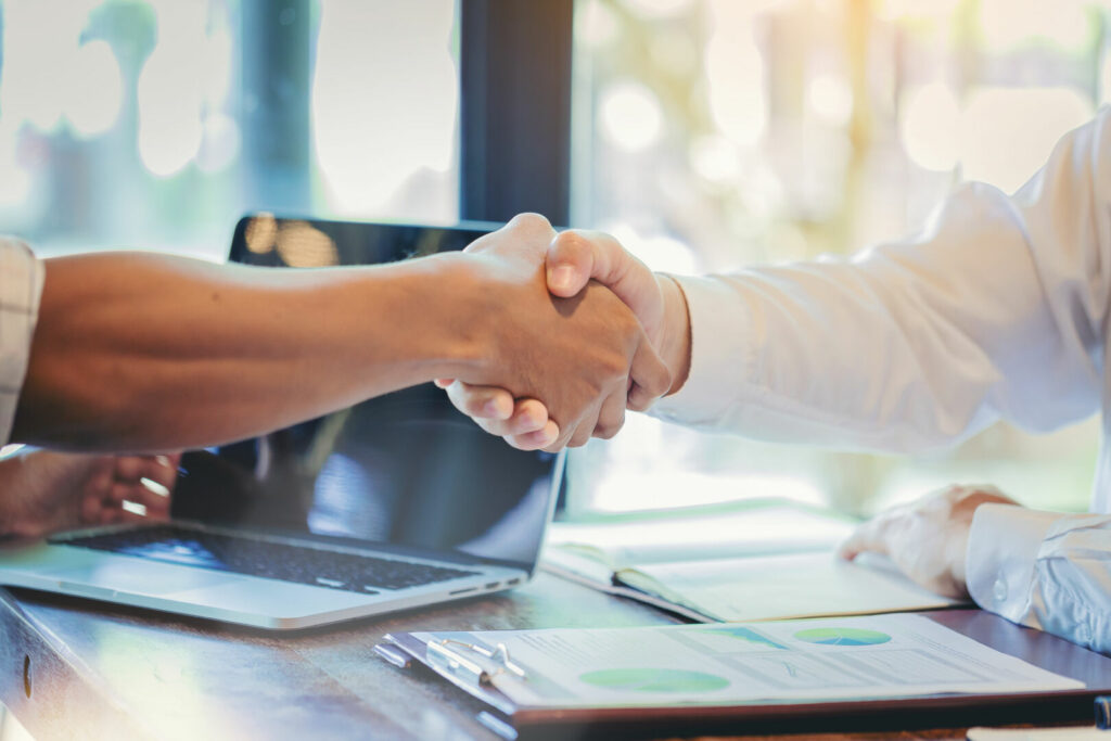 photo : Businessman handshake at business meeting after negotiations wit