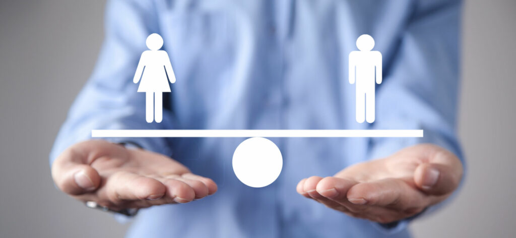 photo : Man showing balance scale. Man and Woman equality