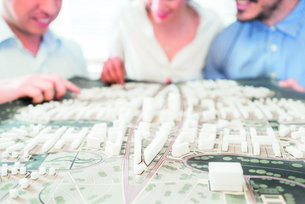 photo : Architects with model for urban development