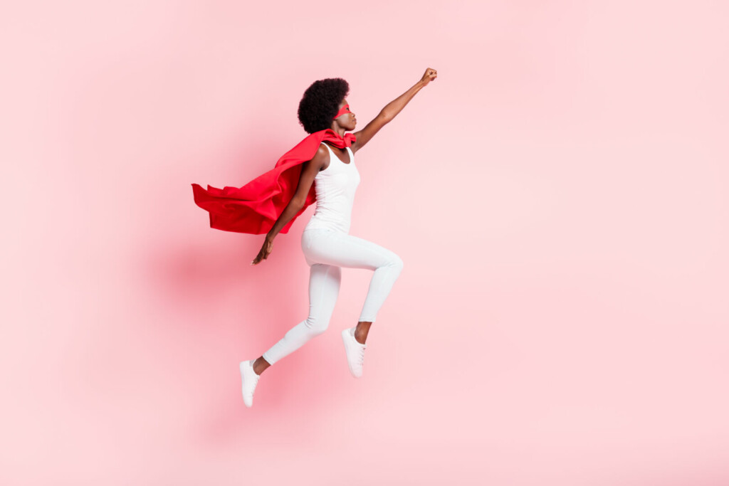 photo : Full length body size view of active slim motivated wavy-haired girl jumping striving isolated on pink pastel color background